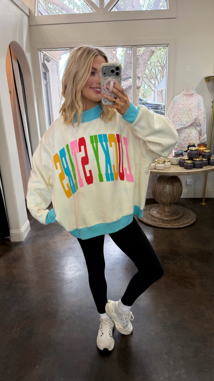 lucky stars reversible mock neck sweatshirt