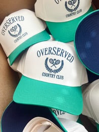 overserved country club trucker hat