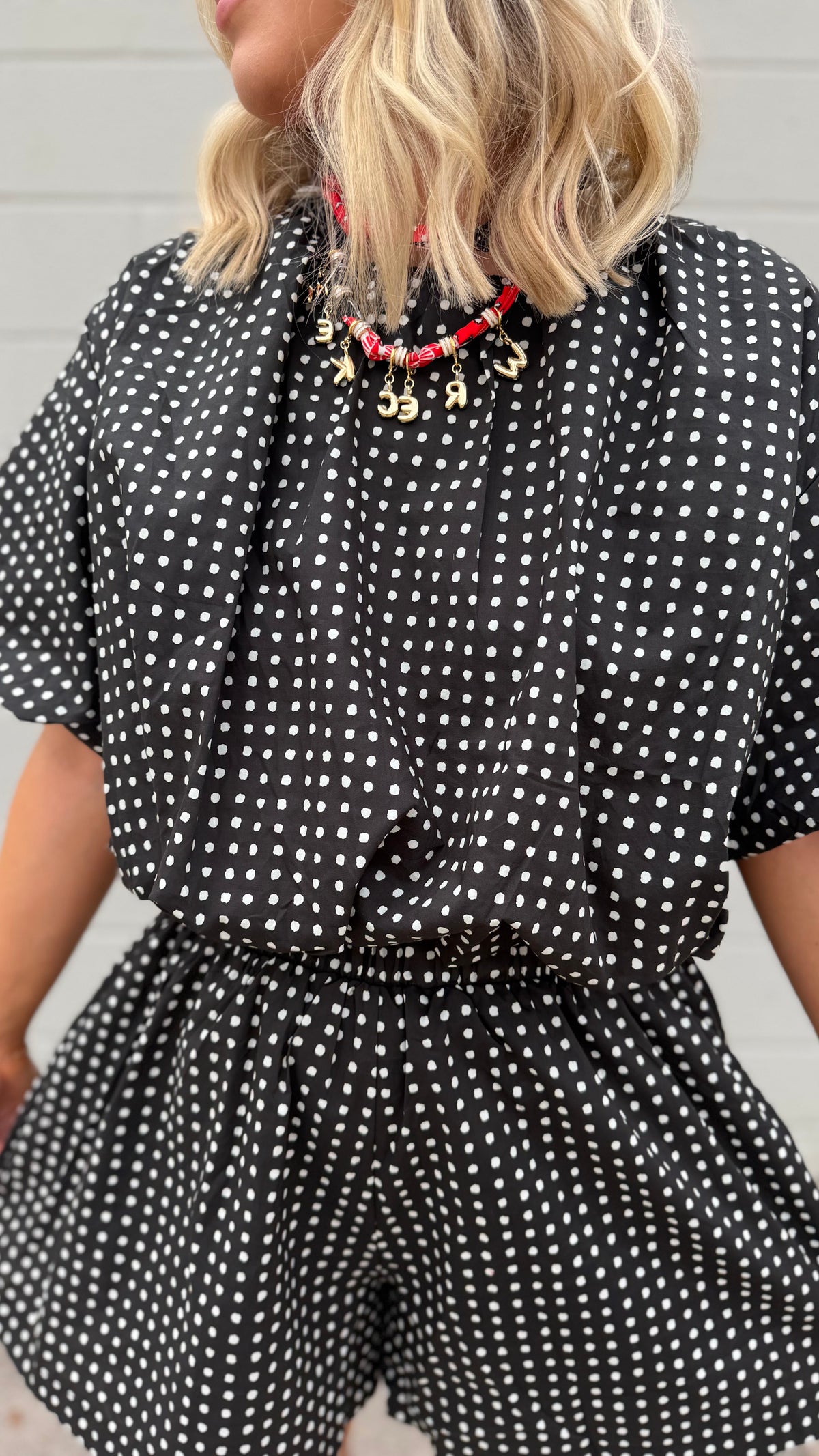 in a moment cropped polka dot top