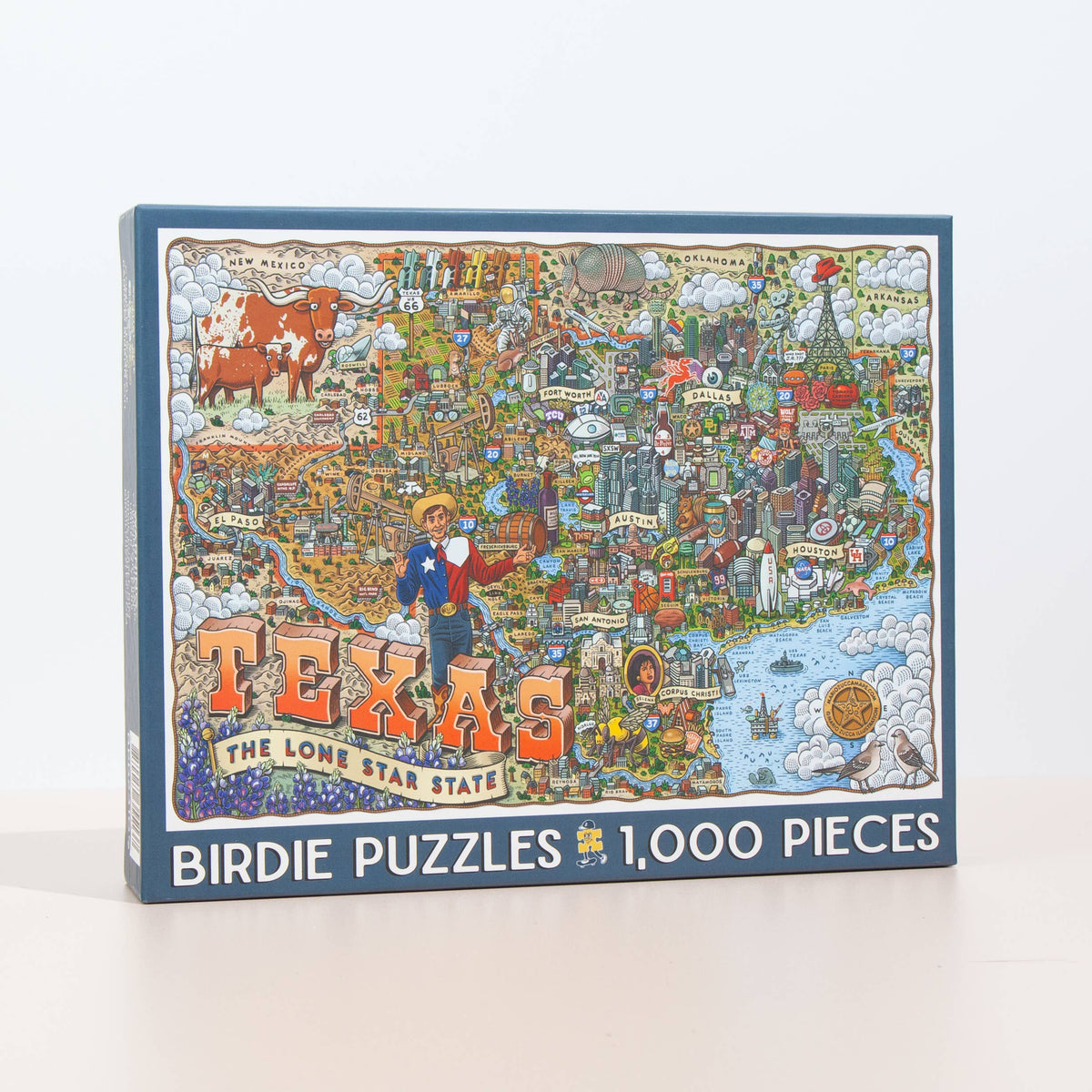 Jigsaw puzzle box featuring a colorful map of Texas with illustrations on a white background.