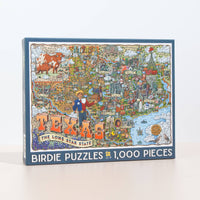Jigsaw puzzle box featuring a colorful map of Texas with illustrations on a white background.